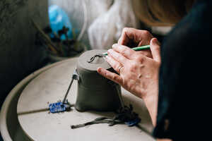 Turning a jug on potter's wheel Turning a jug on potter's wheel