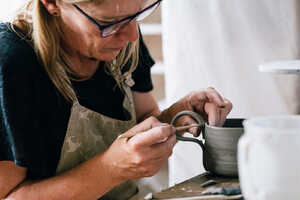 Joining handle to cup Joining handle to cup